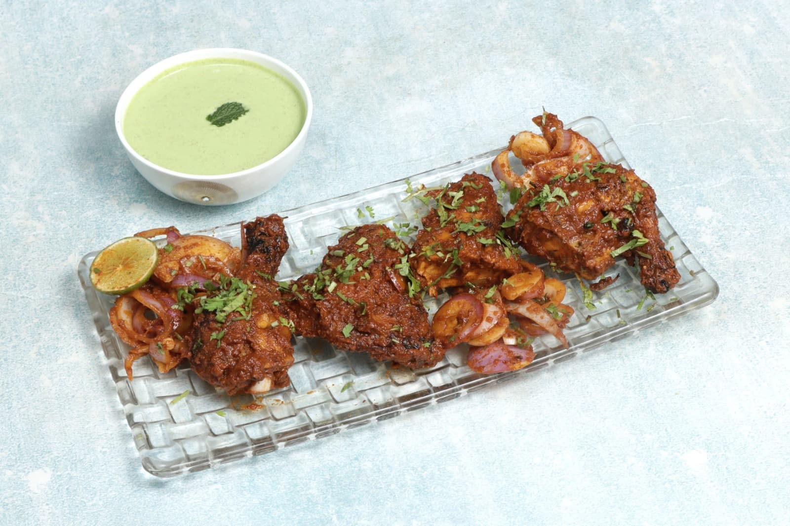 Spicy tandoori chicken tikka with mint chutney